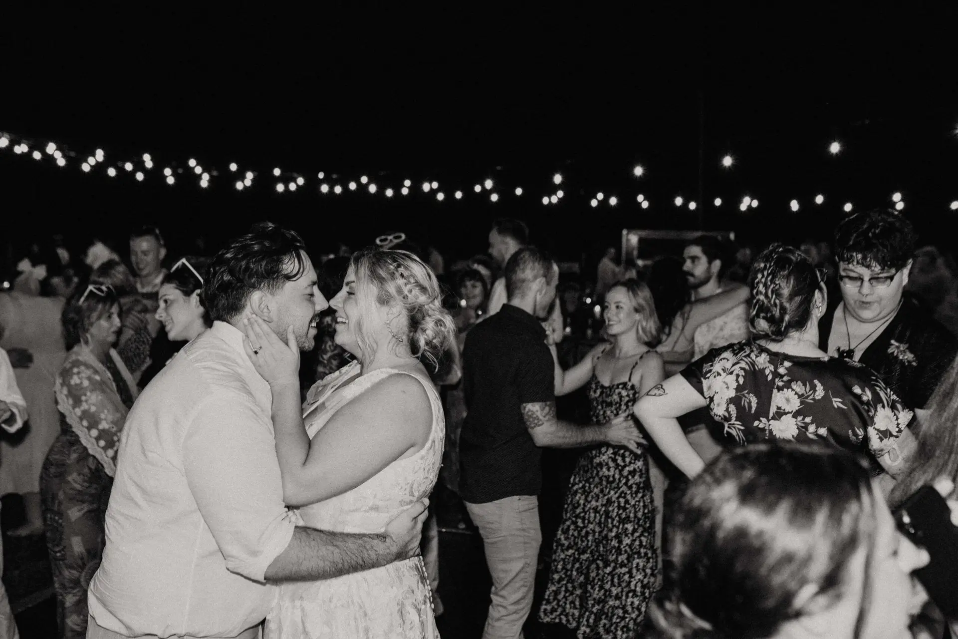 Couple dancing under lights