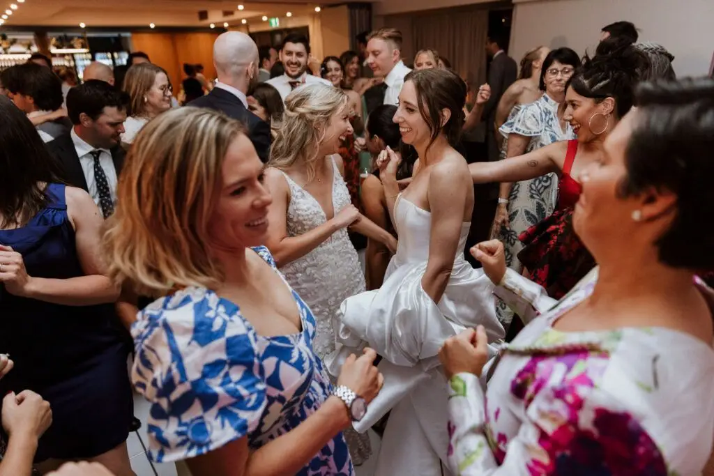 Wedding guests dancing at reception