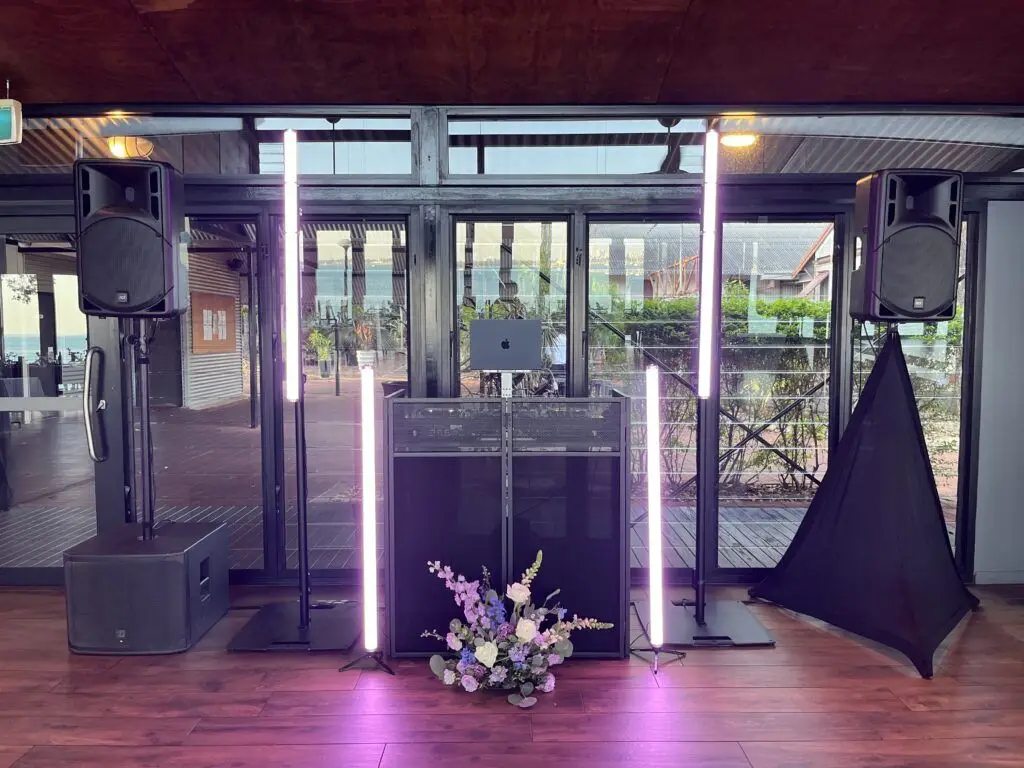 DJ setup with speakers and lights