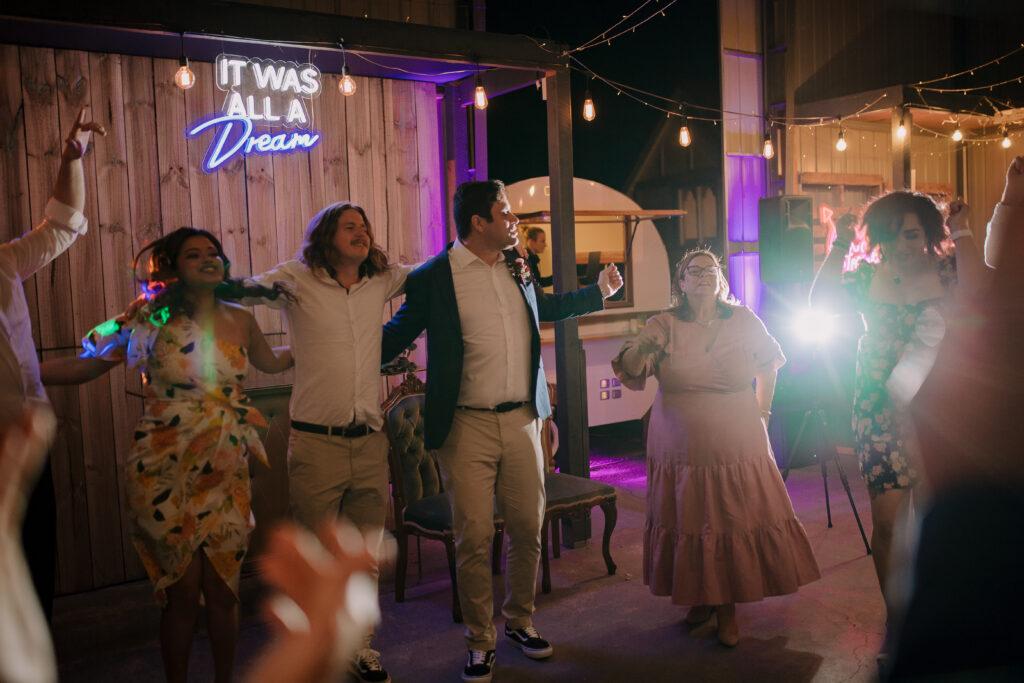 Wedding party dancing outdoors